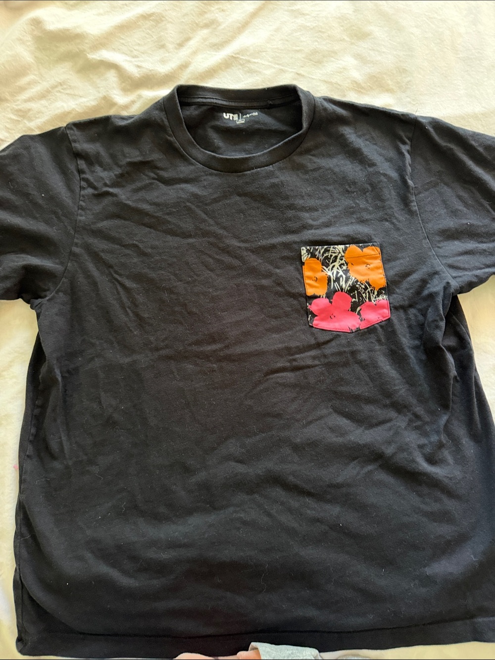 Uniqlo Black Pocket Tee with Orange & Pink Floral Accent